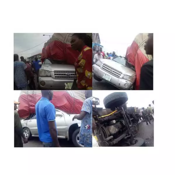 Father And Daughter Escape Death, As Truck Crushes Their SUV In Benin (Photos)